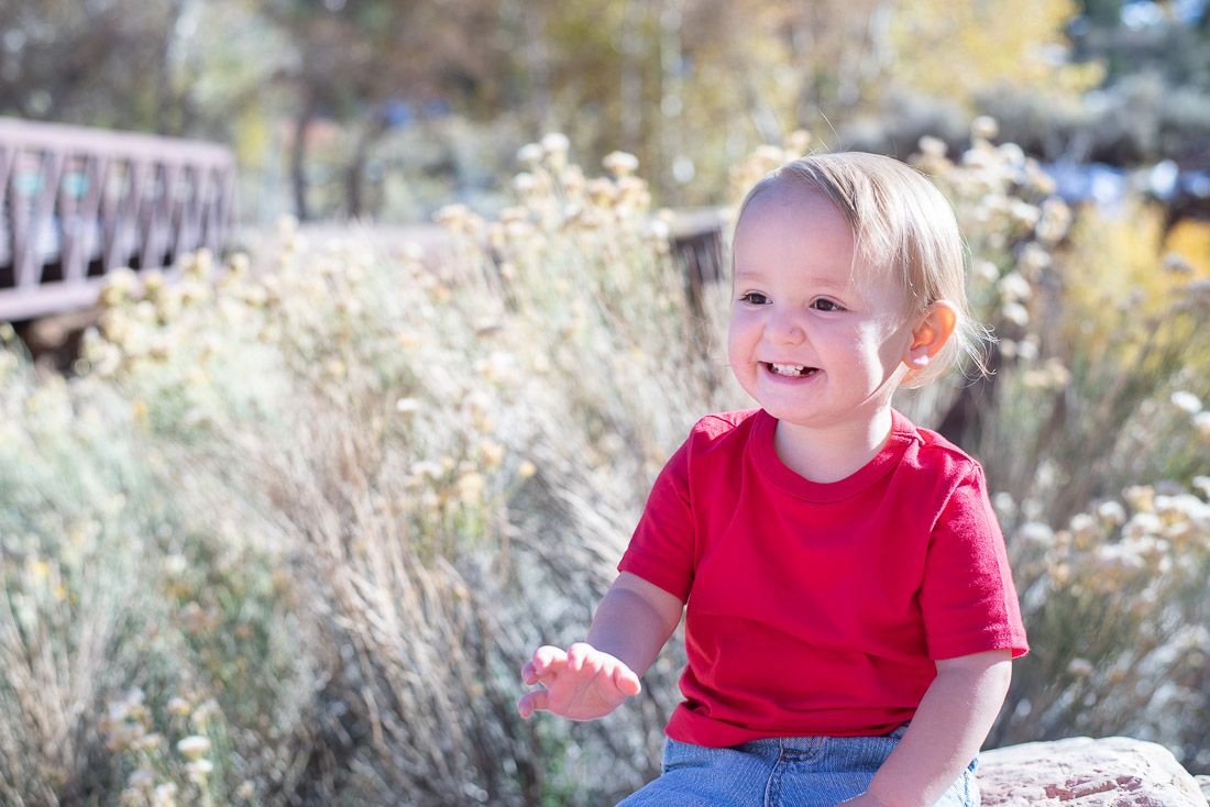 Toddler boy in red shirt laughing-Cedar City Photographer-Bethany Allen
