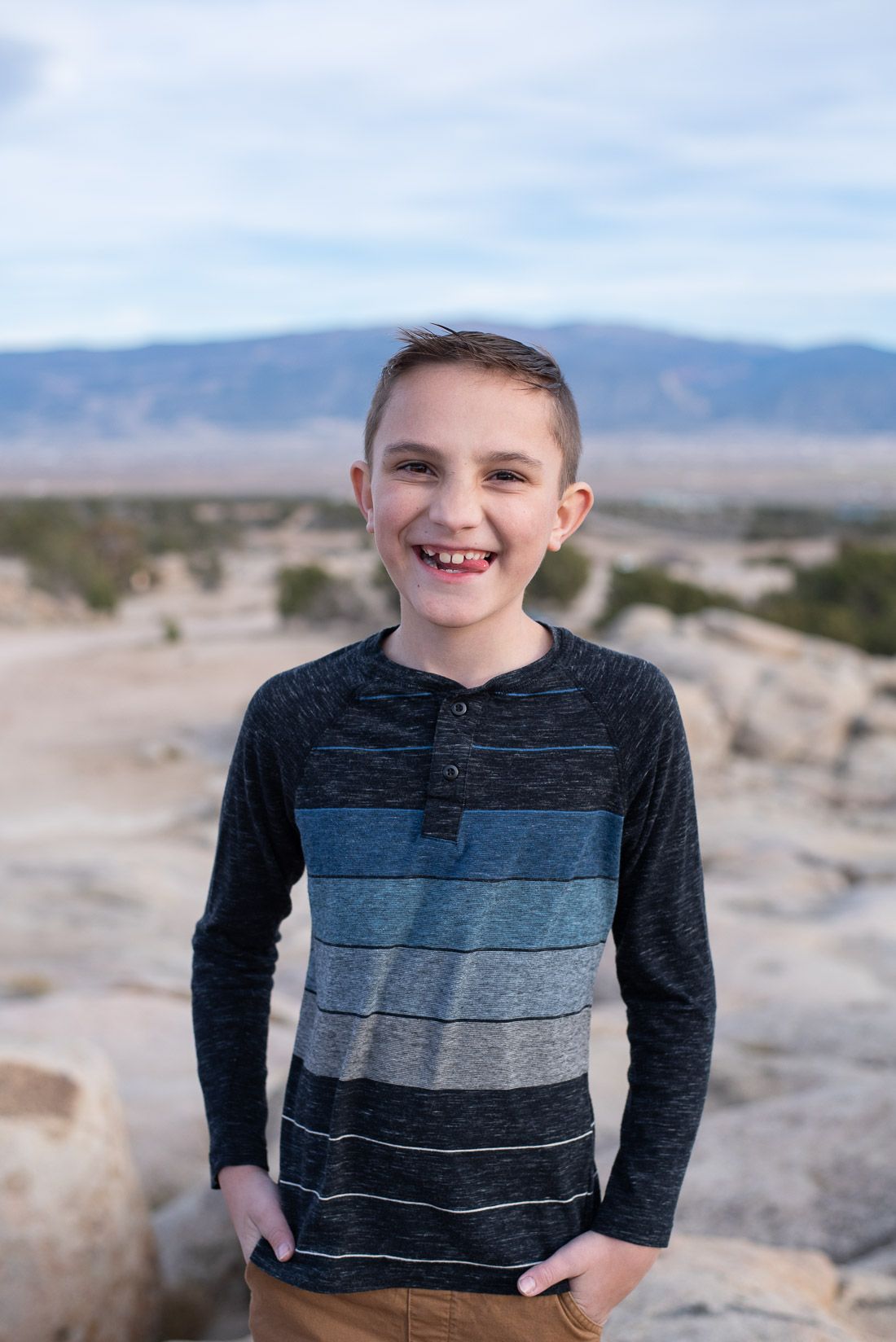 Boy looking at camera and laughing with his tongue poking out-Bethany Allen Photography