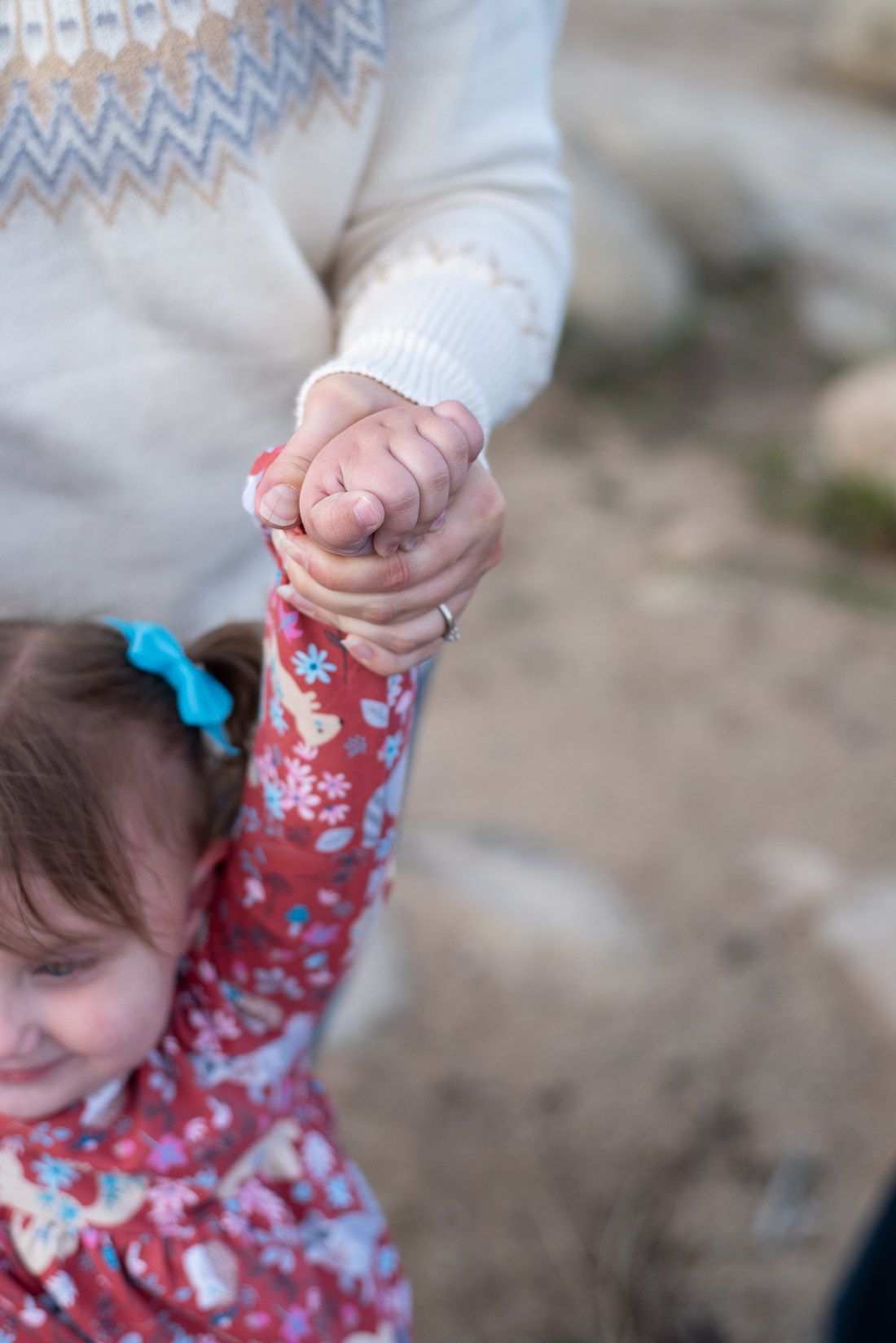 Closeup of mom holding her daughter's hand-Cedar City, Utah family photographer